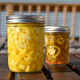 Jars of pickled pineapple and pickled jalapeno slices